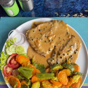Juicy steak with green pepper sauce