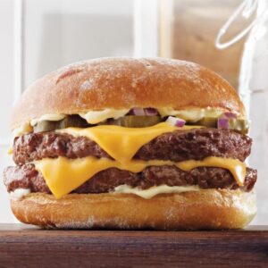 "Double Burger Viande, un burger juteux avec deux steaks hachés, fromage fondu et sauce maison, servi dans un pain brioché frais."