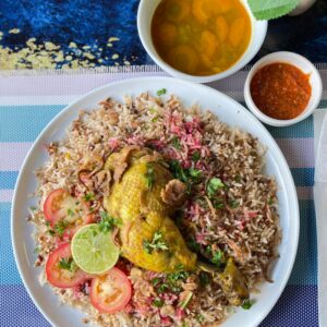 "Dubai-Style Chicken Rice, Emirati specialty with basmati rice, spiced chicken and Gulf spice blend"