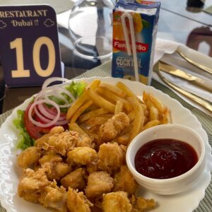 Popcorn Chicken with fries and juice at Badr Dubai Restaurant